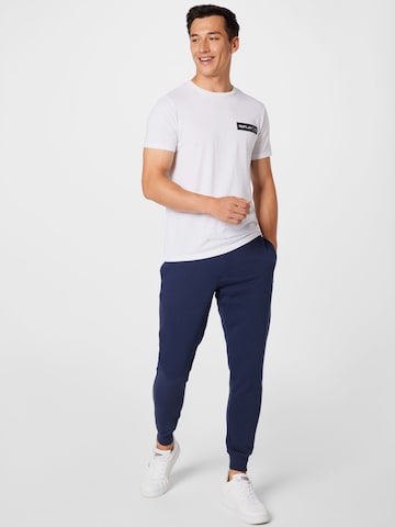 Tapered Pantaloni de la Tommy Jeans pe albastru