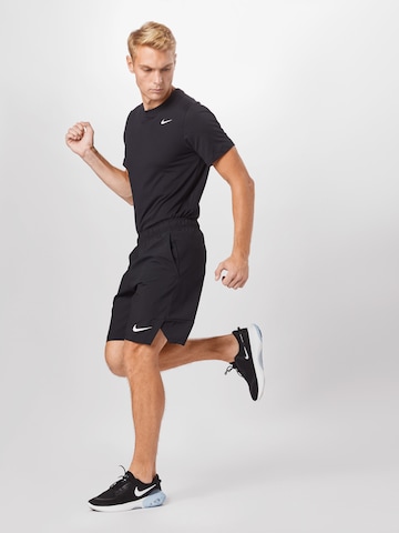 regular Pantaloni sportivi 'FLEX' di NIKE in nero