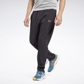 Reebok Regular Workout Pants in Black: front