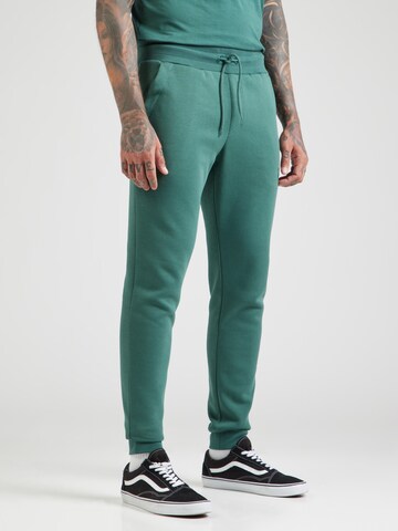 Tapered Pantaloni sportivi 'ESSENTIAL' di BJÖRN BORG in verde: frontale