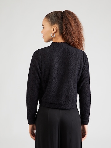 ABOUT YOU Neuletakki 'Saphia' värissä musta