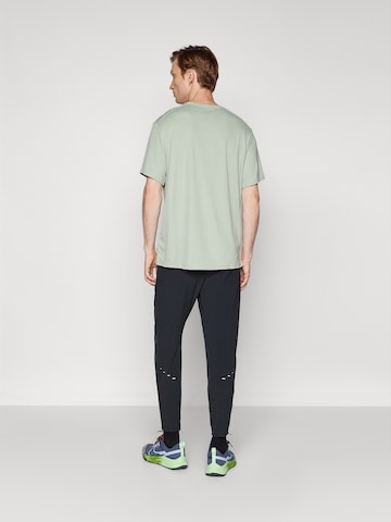 NIKE Tapered Workout Pants 'STRIDE' in Black