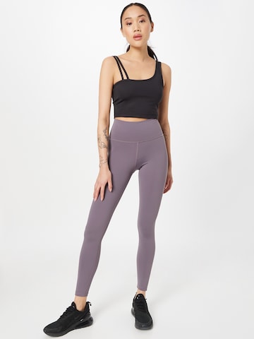 Athlecia Skinny Spodnie sportowe 'GABY' w kolorze fioletowy