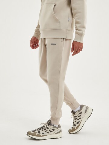 Nicce Tapered Broek 'NEVAS' in Beige: voorkant