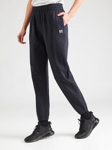 UNDER ARMOUR Tapered Sports trousers in Black: front