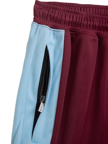 Loosefit Pantaloni sportivi 'Athletic DMWU' di Unfair Athletics in colori misti