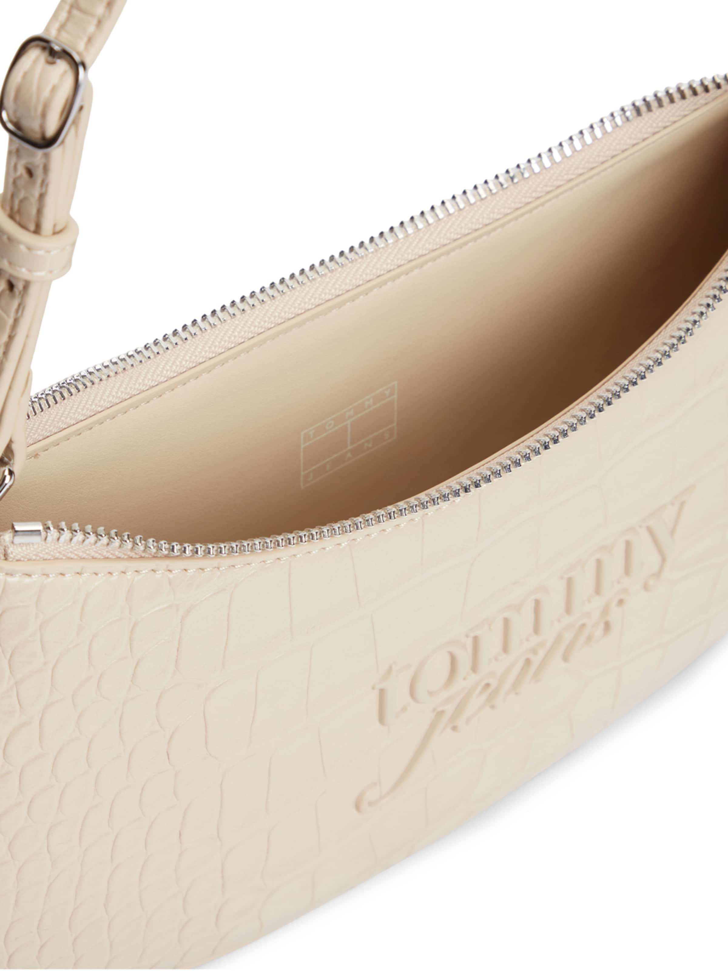 Tommy Jeans Olkalaukku 'MUST' värissä beige