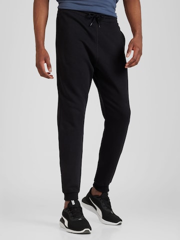 Effilé Pantalon de sport Reebok en noir : devant