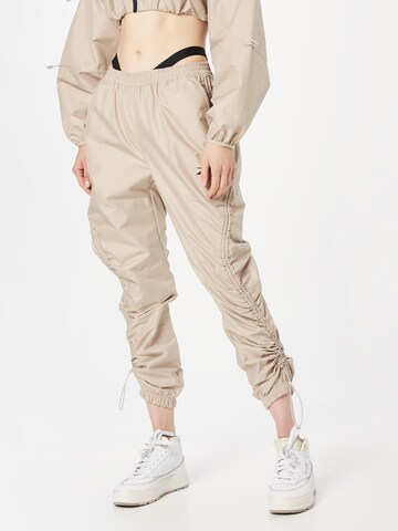 Loosefit Pantalon 'Cardi B' Reebok en beige : devant