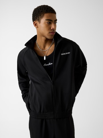 GUESS JEANS Sweatjacka i svart: framsida