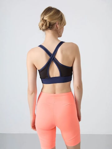 Haut de sport Tommy Life en bleu
