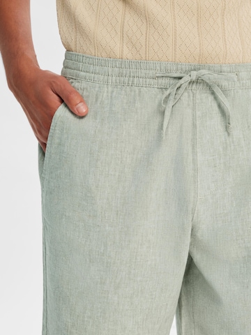 SELECTED HOMME جينز واسع سراويل 'SILAS' بلون أخضر