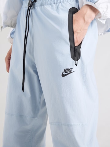 zils Nike Sportswear Pakapēniski sašaurināts piegriezums Bikses