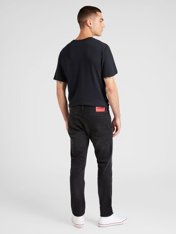 Slimfit Jeans '734' di HUGO in nero