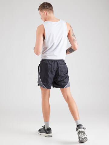 regular Pantaloni sportivi 'Icon Volley' di UNDER ARMOUR in nero