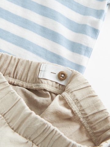 Set di Cool Club in beige