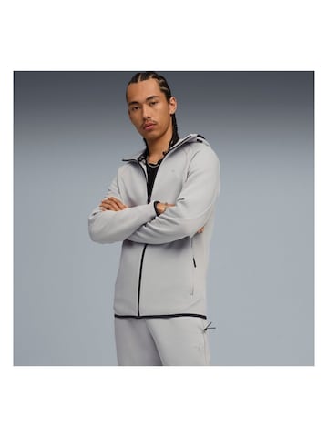 PUMA Sweatjacke 'Puma Evostripe Fz Hoodie Dk'‌‌‌‌ in Grau