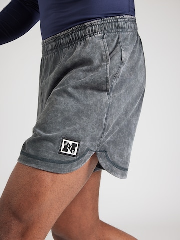 NIKE Normalny krój Spodnie sportowe 'HERITAGE' w kolorze zielony