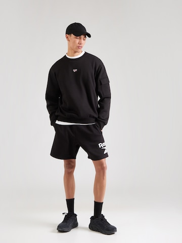 Reebok Urheilullinen collegepaita 'PETER' värissä musta