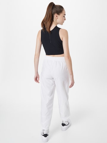 Nike Sportswear Alt kitsenev Püksid 'Essential', värv valge