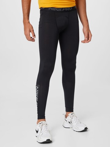 NIKE Skinny Spodnie sportowe w kolorze czarny: przód