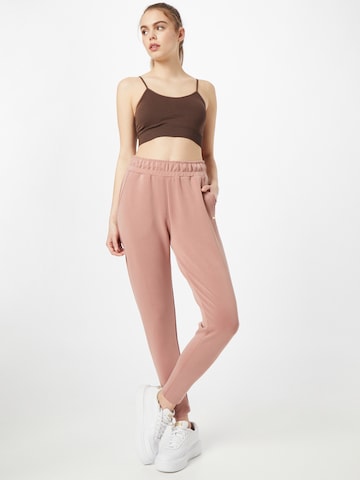 Athlecia Tapered Sportbroek in Roze
