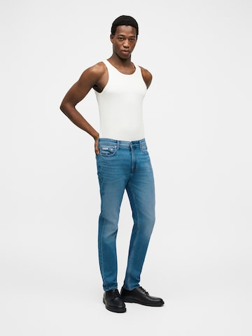 Calvin Klein Jeans Slimfit Farkut 'Richard' värissä sininen