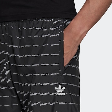 ADIDAS ORIGINALS Tapered Trousers in Black