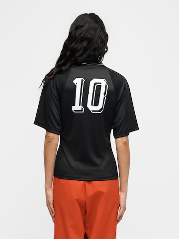 PUMA Μπλουζάκι 'FUTURE.ARCHIVE' σε μαύρο: μπροστά