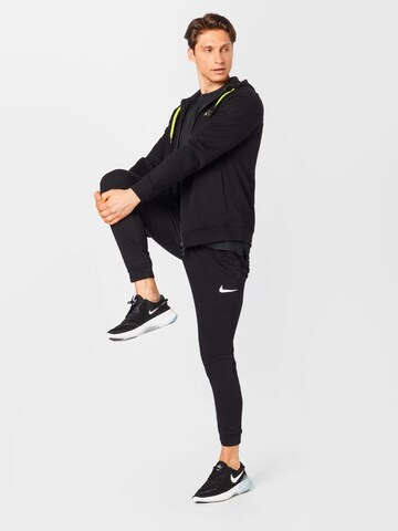 NIKE Tapered Sportbroek in Zwart