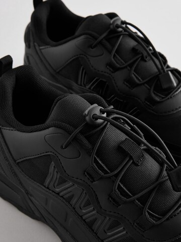 Next Låg sneaker i svart