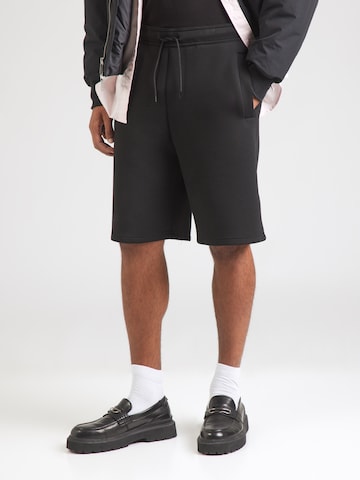 WEEKDAY Loose fit Trousers in Black: front