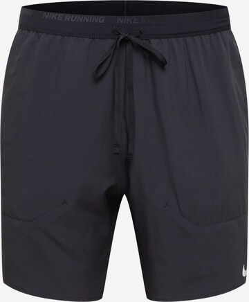 NIKE Regular Workout Pants in Black: front