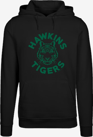 Sweat-shirt 'Stranger Things Hawkins Tigers Netflix TV Series' F4NT4STIC en noir : devant