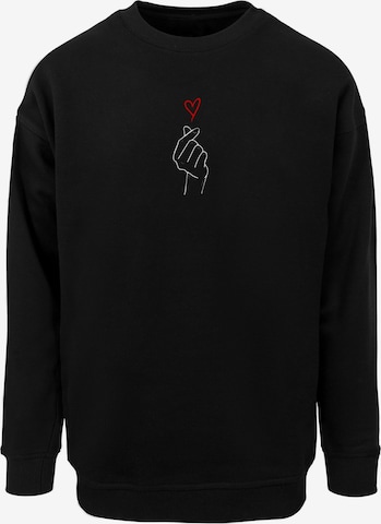 Merchcode Sweatshirt 'K Heart' in Zwart: voorkant
