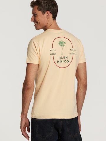 Tricou 'Tulum' de la Shiwi pe portocaliu