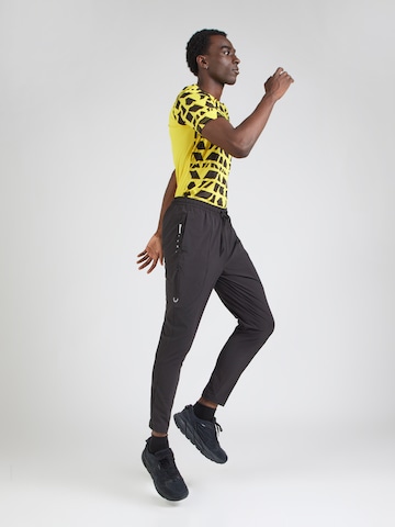 PUMA Tapered Sportbroek 'FLEX' in Zwart