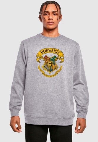 ABSOLUTE CULT Sweatshirt 'Harry Potter - Hogwarts Crest' in Grijs: voorkant