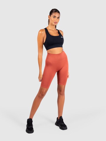 Smilodox Skinny Workout Pants 'Bloom' in Orange