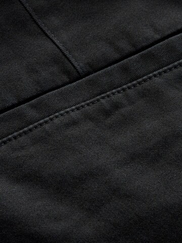Slimfit Pantaloni chino di Next in nero