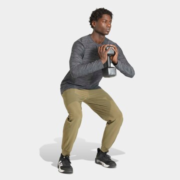 ADIDAS PERFORMANCE Tapered Workout Pants in Green
