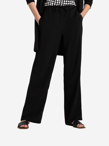 MORE & MORE Loose fit Trousers in Black: front