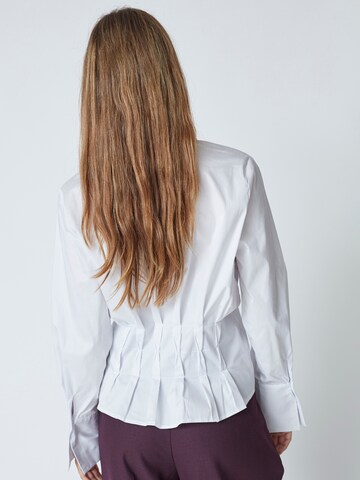 Chemisier 'Poppy' co'couture en blanc