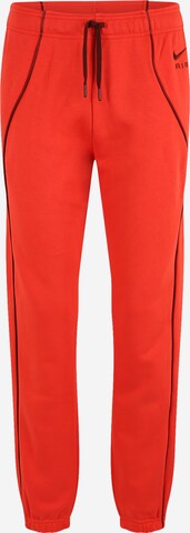 Nike Sportswear Tapered Trousers in Red: front