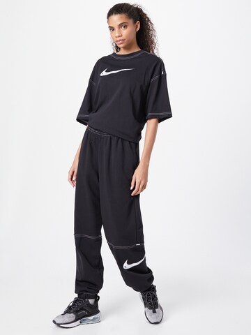 Tapered Pantaloni de la Nike Sportswear pe negru