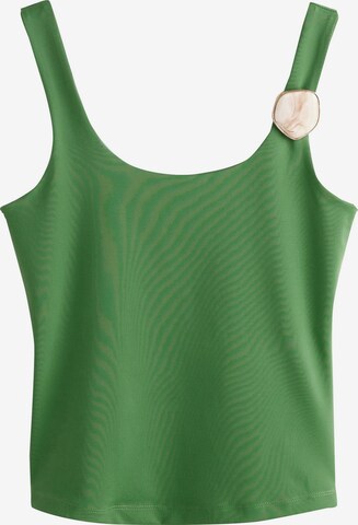 Next - Top en verde: frente
