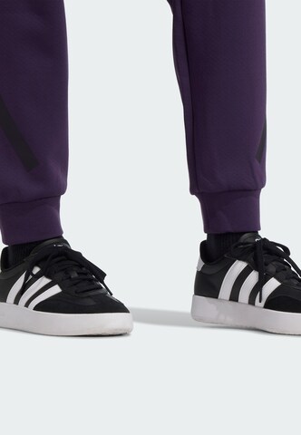 Tapered Pantaloni sportivi 'Z.N.E.' di ADIDAS SPORTSWEAR in lilla