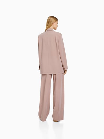 Bershka Loose fit Pleat-front trousers in Pink