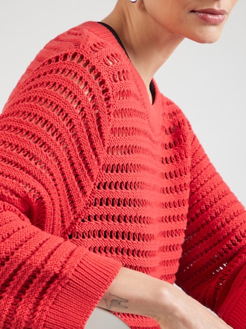 Pullover di monari in arancione