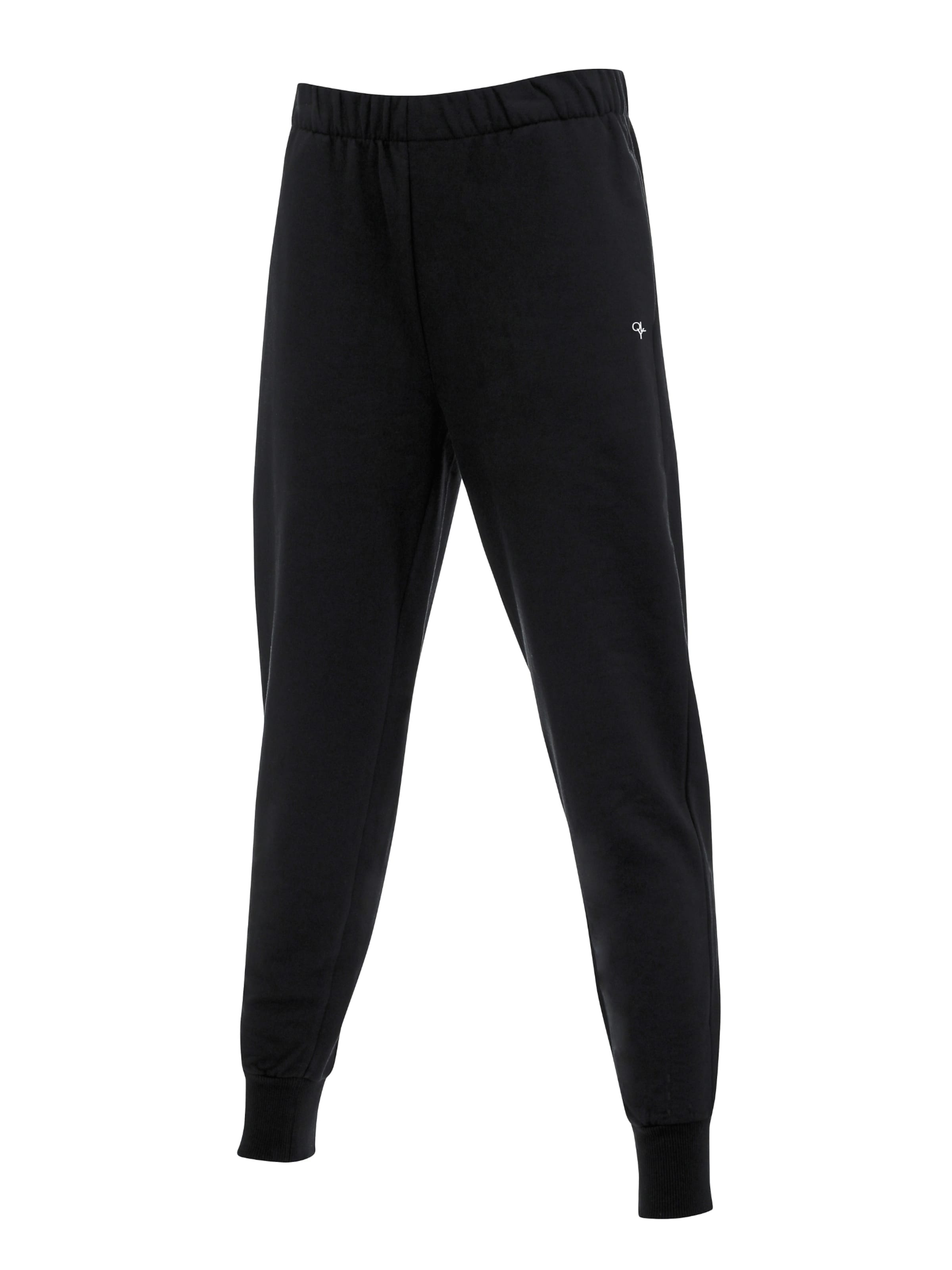 OLYMPIA Tapered Trousers in Black: front